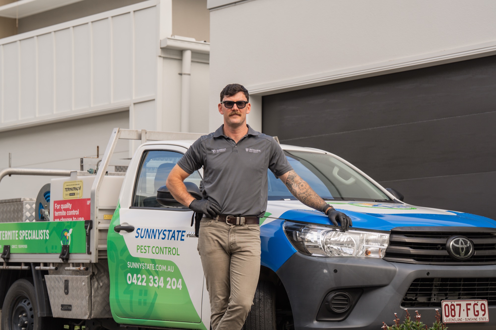 Sunnystate Pest Control technician arriving at a Brisbane property